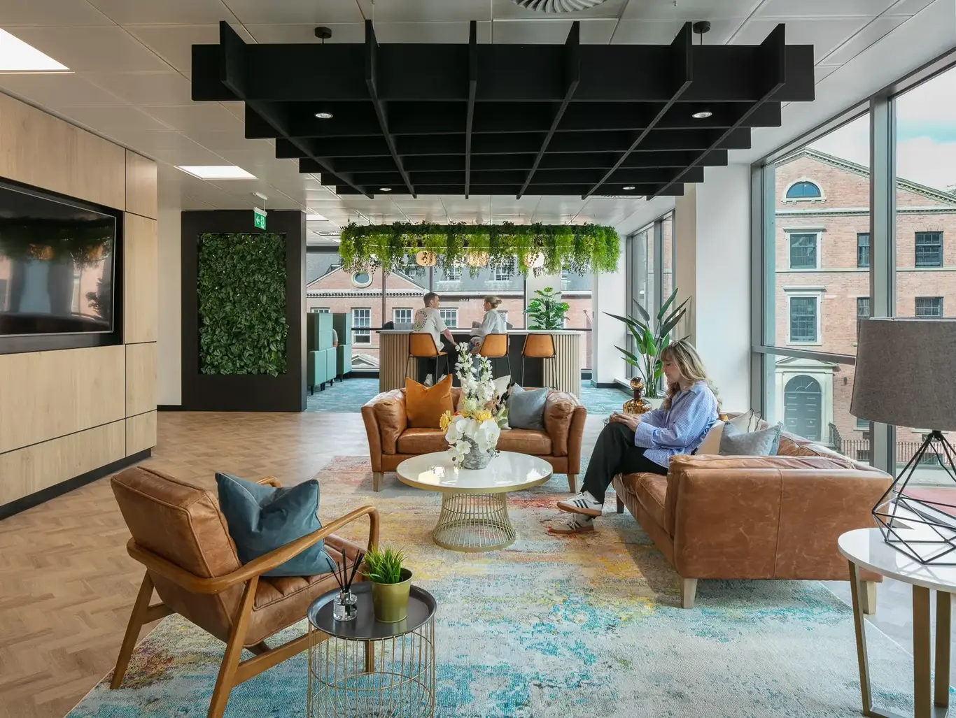 a room with a couple of people sitting on a couch