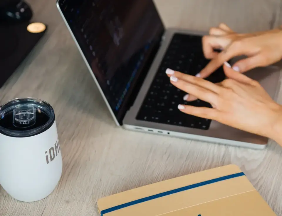 a person typing on a laptop